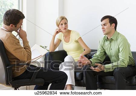 Couple discussing issues during therapy View Large Photo Image Picture - Couple discussing issues during therapy. Fotosearch