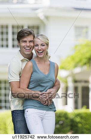 Couple in front of house View Large Photo Image Stock Image - Couple in front of house. Fotosearch