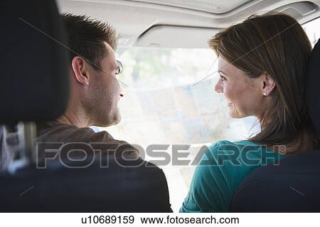 Couple sitting in car View Large Photo Image Stock Photo - Couple sitting in car. Fotosearch