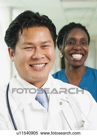 Stock Photography - Doctor and nurse posing for portrait. Fotosearch