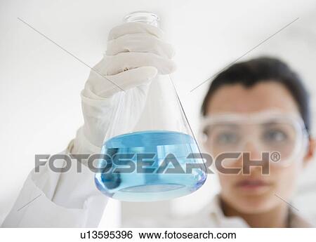 Female lab technician holding viale View Large Photo Image Stock Photograph - Female lab technician holding viale. Fotosearch