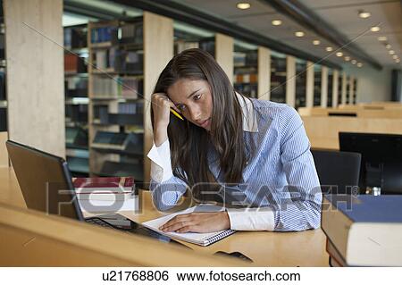 Female student studying in library View Large Photo Image Stock Photograph - Female student studying in library. Fotosearch