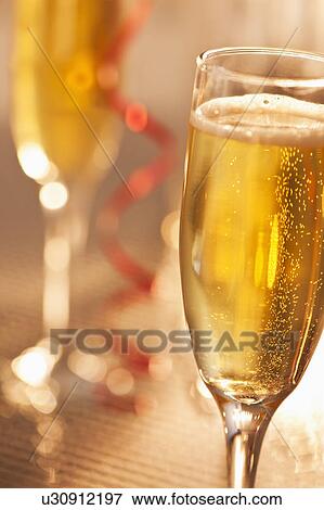 Flutes with champagne, close-up View Large Photo Image Stock Photo - Flutes with champagne, close-up. Fotosearch