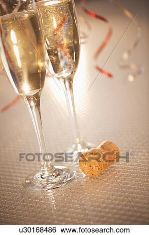 Flutes with champagne, close-up View Large Photo Image Stock Photograph - Flutes with champagne, close-up. Fotosearch