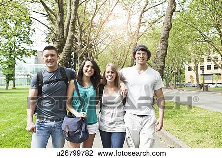 Four friends walking in park View Large Photo Image Stock Image - Four friends walking in park. Fotosearch