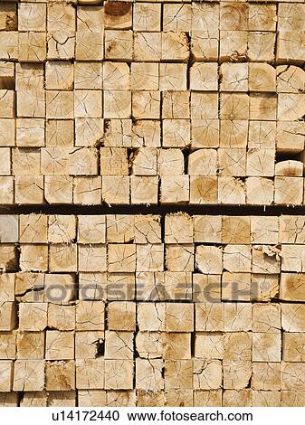 Stock Image - Full-frame shot of orderly timber stacks. Fotosearch