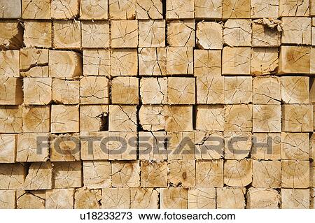 Stock Image - Full-frame shot of orderly timber stacks. Fotosearch