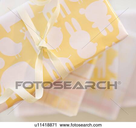Stock Image - Gift boxes wrapped in pastel colored paper. Fotosearch
