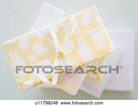 Stock Photo - Gift boxes wrapped in pastel colored paper. Fotosearch