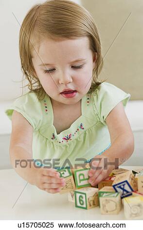 Girl (2-3) playing with letter blocks View Large Photo Image Stock Photography - Girl (2-3) playing with letter blocks. Fotosearch