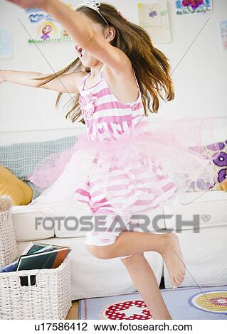 Girl ( 6-7) dancing in her room View Large Photo Image Stock Image - Girl ( 6-7) dancing in her room. Fotosearch