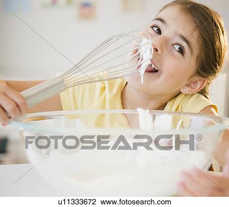 Girl ( 6-7) licking whipped cream from whisk View Large Photo Image Stock Image - Girl ( 6-7) licking whipped cream from whisk. Fotosearch