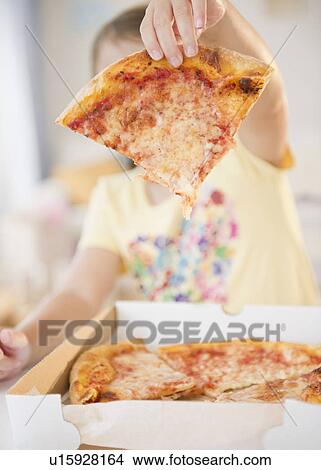 Girl ( 6-7) showing slice of pizza View Large Photo Image Picture - Girl ( 6-7) showing slice of pizza. Fotosearch