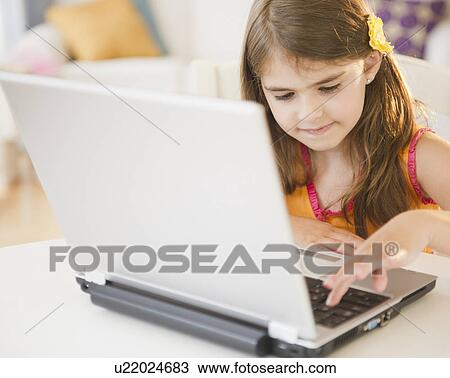 Girl ( 6-7) using laptop View Large Photo Image Stock Image - Girl ( 6-7) using laptop. Fotosearch