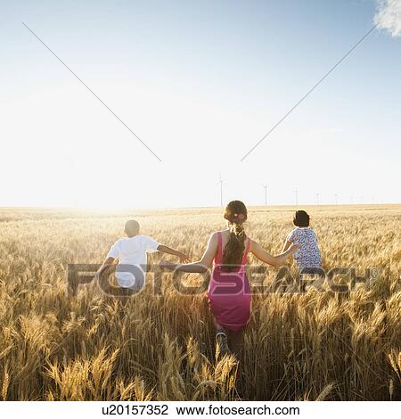 Girls (10-11, 12-13) and boy (8-9) walking though wheat field View Large Photo Image Stock Image - Girls (10-11, 12-13) and boy (8-9) walking though wheat field. Fotosearch