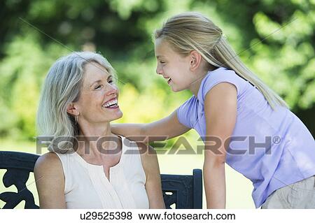Grandmother with granddaughter (10-11) looking at each other View Large Photo Image Stock Photo - Grandmother with granddaughter (10-11) looking at each other. Fotosearch