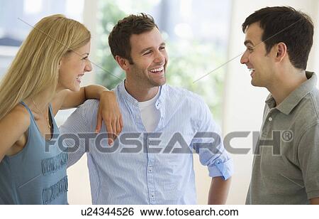 Group of friends talking View Large Photo Image Stock Photograph - Group of friends talking. Fotosearch