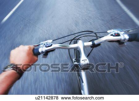 Hand gripping handlebar of bike View Large Photo Image Stock Photo - Hand gripping handlebar of bike. Fotosearch