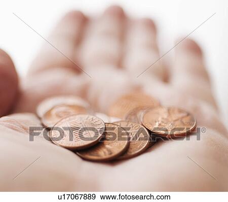 Stock Photo - Hand with one cents coins. Fotosearch