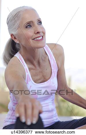 Mature woman stretching View Large Photo Image Stock Photo - Mature woman stretching. Fotosearch