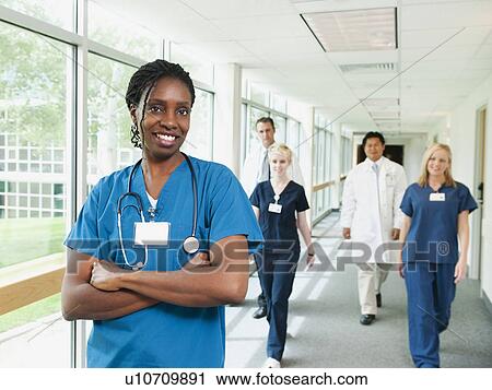 Medical staff posing together View Large Photo Image Stock Image - Medical staff posing together. Fotosearch
