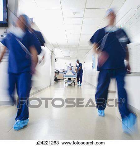 Medical team and patient moving towards operating room before surgery View Large Photo Image Stock Image - Medical team and patient moving towards operating room before surgery. Fotosearch