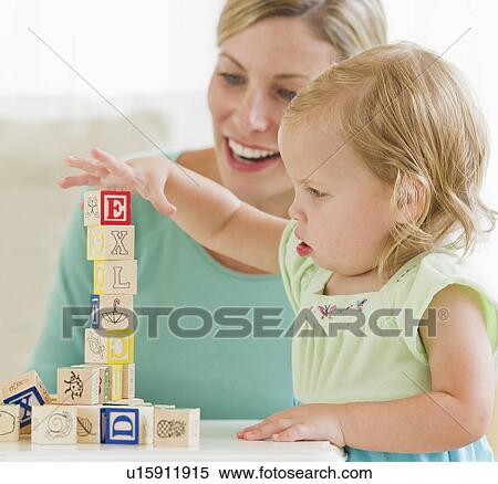 Mother and daughter (2-3) playing with letter blocks View Large Photo Image Stock Photography - Mother and daughter (2-3) playing with letter blocks. Fotosearch