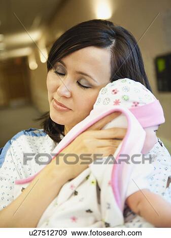 Mother holding baby daughter (2-5 months) View Large Photo Image Stock Photo - Mother holding baby daughter (2-5 months). Fotosearch