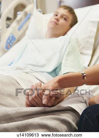 Mother visiting son (10-11) in hospital View Large Photo Image Stock Image - Mother visiting son (10-11) in hospital. Fotosearch