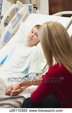 Mother visiting son (10-11) in hospital View Large Photo Image Stock Image - Mother visiting son (10-11) in hospital. Fotosearch