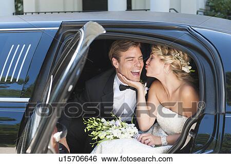 Newly wed couple sitting in limousine View Large Photo Image Stock Photograph - Newly wed couple sitting in limousine. Fotosearch
