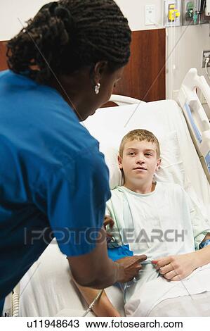 Nurse checking blood pressure to boy (10-11) View Large Photo Image Stock Image - Nurse checking blood pressure to boy (10-11). Fotosearch