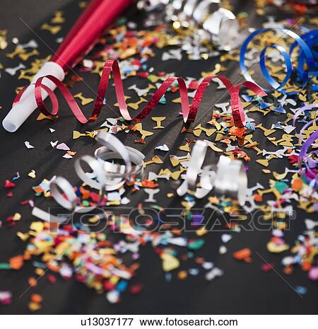 Party horn blowers and confetti View Large Photo Image Stock Photo - Party horn blowers and confetti. Fotosearch