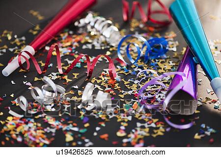 Party horn blowers and confetti View Large Photo Image Stock Photography - Party horn blowers and confetti. Fotosearch