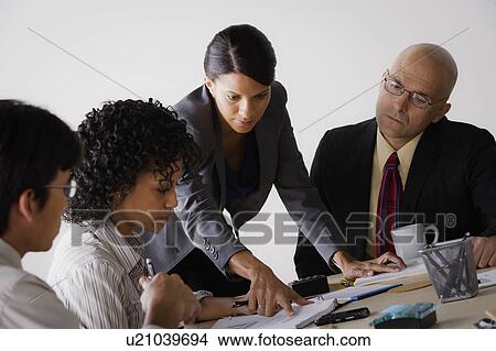 Picture - People discussing at business meeting. Fotosearch
