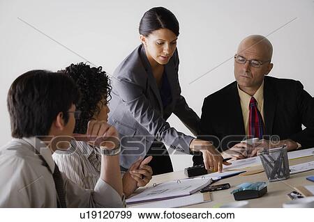 People discussing at business meeting View Large Photo Image Stock Photo - People discussing at business meeting. Fotosearch