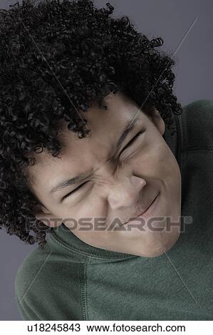 Portrait of boy (8-9) looking angry, studio shot View Large Photo Image Stock Image - Portrait of boy (8-9) looking angry, studio shot. Fotosearch