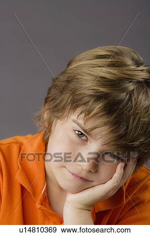 Portrait of boy (8-9), studio shot View Large Photo Image Stock Photo - Portrait of boy (8-9), studio shot. Fotosearch