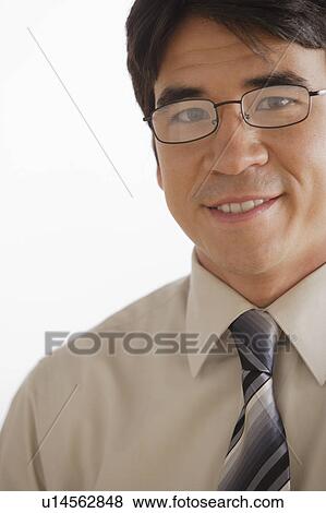 Stock Photo - Portrait of business man smiling. Fotosearch