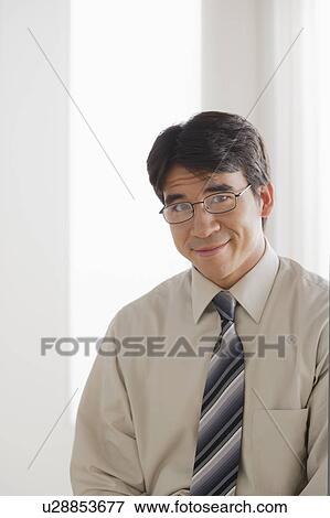 Stock Photo - Portrait of business man smiling. Fotosearch