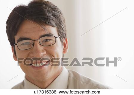 Portrait of business man smiling View Large Photo Image Stock Photograph - Portrait of business man smiling. Fotosearch