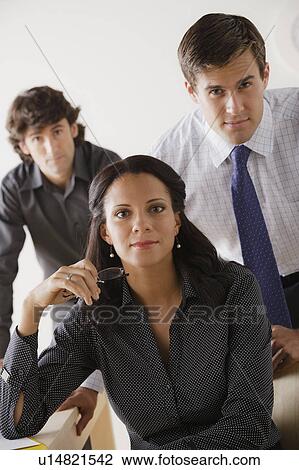Stock Image - Portrait of business people in office. Fotosearch