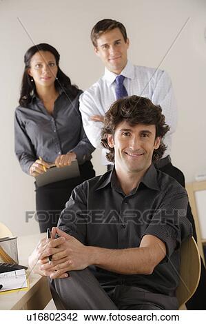 Stock Image - Portrait of business people in office. Fotosearch