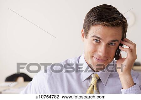 Portrait of businessman talking on phone View Large Photo Image Stock Image - Portrait of businessman talking on phone. Fotosearch