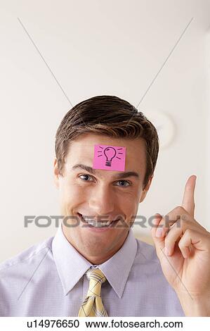 Portrait of businessman with adhesive note attached on forehead View Large Photo Image Stock Image - Portrait of businessman with adhesive note attached on forehead. Fotosearch