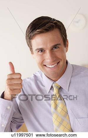 Portrait of businessman with thumbs up View Large Photo Image Stock Image - Portrait of businessman with thumbs up. Fotosearch
