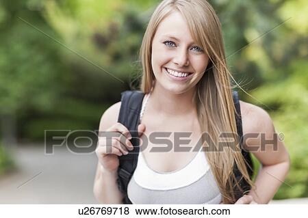 Portrait of female college student smiling View Large Photo Image Stock Photo - Portrait of female college student smiling. Fotosearch