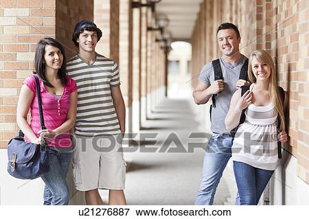 Portrait of four college students in corridor View Large Photo Image Stock Photo - Portrait of four college students in corridor. Fotosearch