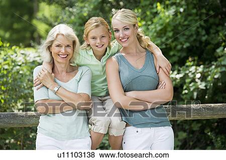 Portrait of girl (10-11) with mother and grandmother View Large Photo Image Stock Photo - Portrait of girl (10-11) with mother and grandmother. Fotosearch