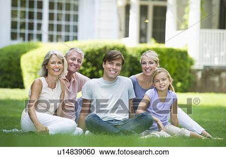 Stock Image - Portrait of girl (10-11) with parents and grandparents. Fotosearch